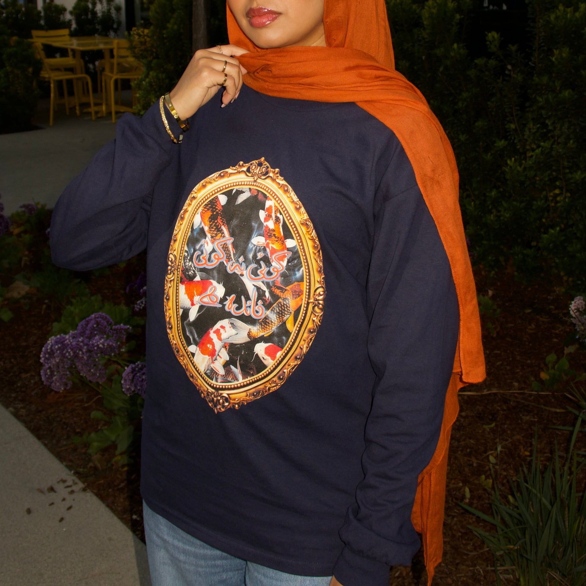 model wearing navy koi tee size M